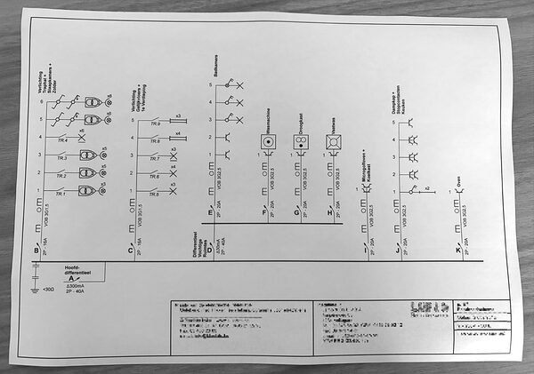 Photo of an existing single-line diagram on paper.